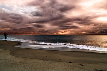 Beautiful stormy sky over Atlantic ocean. Colorful dramatic seascape with dark clouds. Ocean surf.