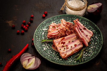 Ribs cooking with sauce marinade ingredients on black food background, big size resolution. Top flat view. space for text