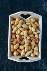 peanuts on a dark surface