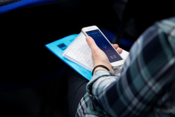 close up investor man hand gesture hold mobile phone device for reading or write digital content concept.