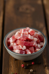 bacon cubes on wooden surface