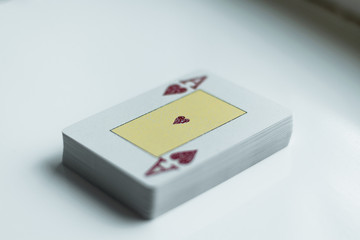 Deck of playing cards with the ace of hearts at the top