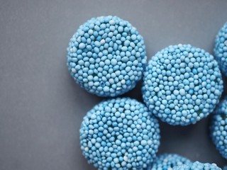 Blue liquorice allsort sweets close up. Macro photography.
