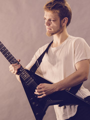 Man playing on electric guitar