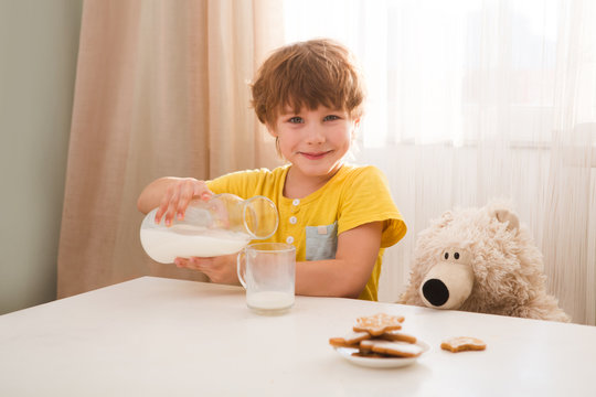 Child Boy Drinks Milk And Eats Cookies Home Kitchen 