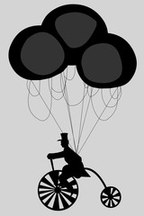 Silhouette of a cyclist with balloons