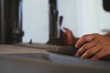 hand operating forklift truck in factory