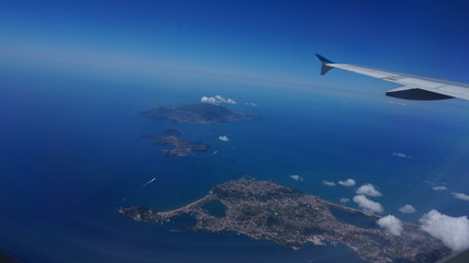 Fototapeta na wymiar Flying over the islands of Ischia and Procida, Campania, Italy