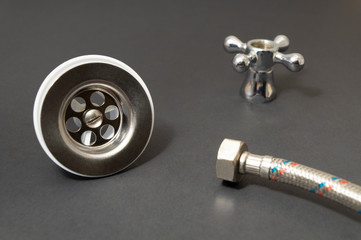 Concept of plumbing works top view on black background.