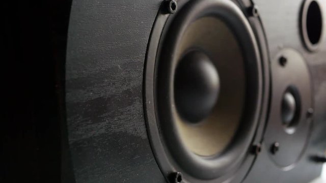 Black wooden speaker play loud music. 
