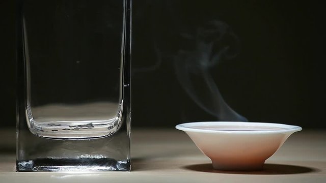 Black Hot Chinese tea cup wooden table dark background nobody hd footage 