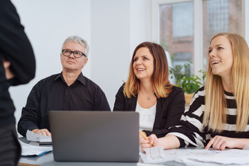 Business team sitting listening to a manager