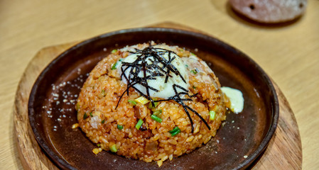 Fried rice with egg yolk and seaweed topping