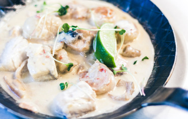 Seafood cream saute with lime in pan in restaurant.