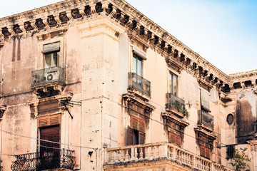 Beautiful cityscape of Italy, historical street of Catania, Sicily, facade of old buildings.