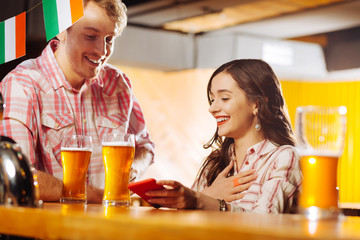 Woman with bright lips feeling joyful communicating with boyfriend