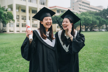 graduate student woman happy talk using smartphone smiling. young college girl friends having phone...