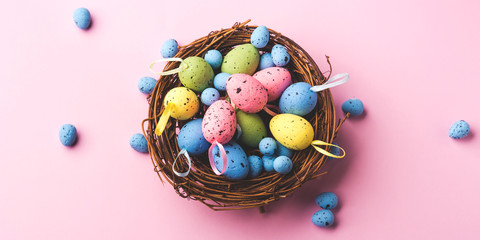 Fototapeta na wymiar Decor easter eggs on pink background