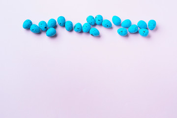 Blue decor easter eggs on pink background