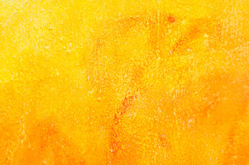 closeup of orange painting on the wall texture