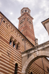 Fototapeta na wymiar View at the Palazzo della Ragione and Arco della Costa in Verona, Italy