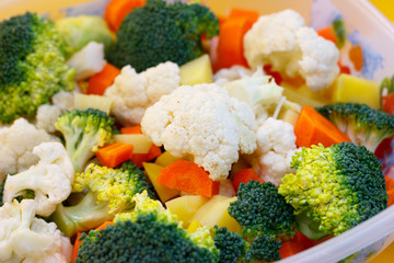 Fresh vegetables are basis of Healthy food. Bright carrots, broccoli, cauliflower, cabbage are ingredients for cooking vegetables and a vegetarian diet. Soft focus.