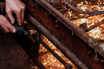 Cutting steel with plasma. Male welder cuts metal plasma.