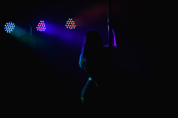 Young slim pole dance woman.