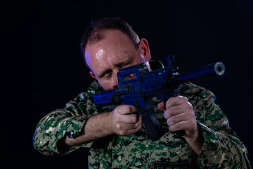 Soldier holding assault rifle