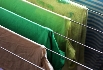 Different types of clothes left hanging to dry