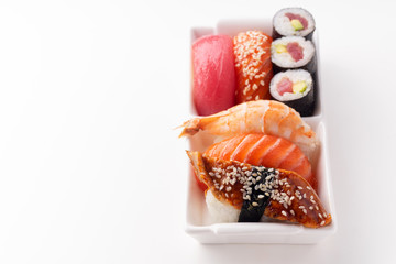 Creative layout with various sushi on white background. Shrimp, eel, salmon and tuna