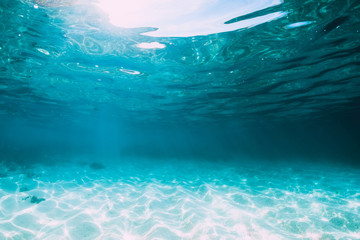 Tropical blue ocean with white sand underwater in Hawaii