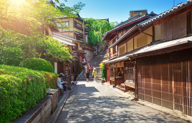 Fototapeta na wymiar View to small street with Sakura tree in Higashiyama district, Kyoto, Japan