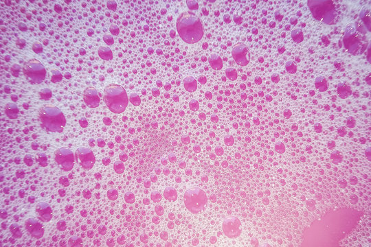 Pink soap bubbles. Abstract purple bubbles from soap for background.