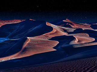 desert of namib at night with orange sand dunes and starry sky