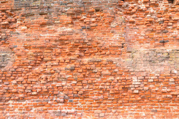 Red brick wall of ruins texture facade