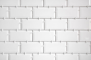Ceramic tile lying. Installing new subway or metro tiles in bathroom, shower or kitchen back splash...