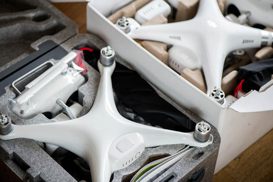 Two brand new unboxed drones in carry boxes. Concept of rapid technology development and comparing two devices