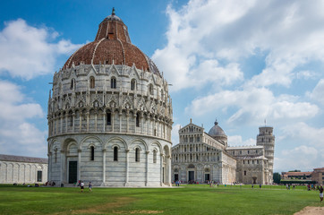 Wide angle view of Romanesque Baptistery of St. John Baptistry at Piazza dei Miracoli Piazza del Duomo popular tourist attraction in Pisa, Italy