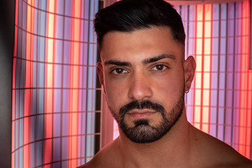 Portrait of muscle guy in collagen solarium