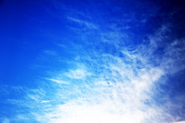 blue sky with clouds and sun