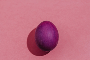 Easter background with Easter eggs. Top view with copy space. multicolored Easter eggs on a pink background