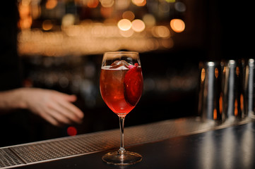 Delicious cocktail with a decor of red vegetable slice