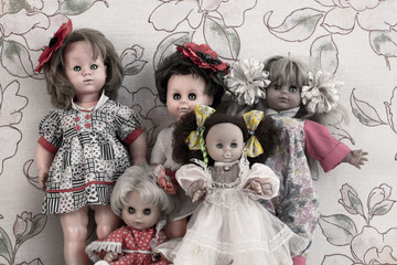 Several creepy female dolls with scary eyes