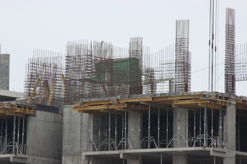 construction works of modern low-rise residential buildings. construction site at the house. cranes, special equipment facilitating work. construction work in progress. reset the frame house.