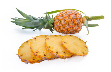 Whole and sliced pineapple isolated on white background