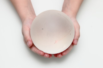 Magic crystal ball of prediction.Magic crystal ball with a matte finish in the hands of a child.