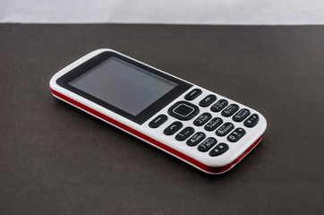 push-button mobile phone on a gray background