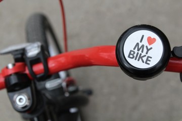 Bicycle steering wheel with bell and handles.