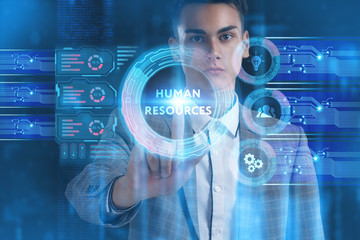 The concept of business, technology, the Internet and the network. A young entrepreneur working on a virtual screen of the future and sees the inscription: Human resources